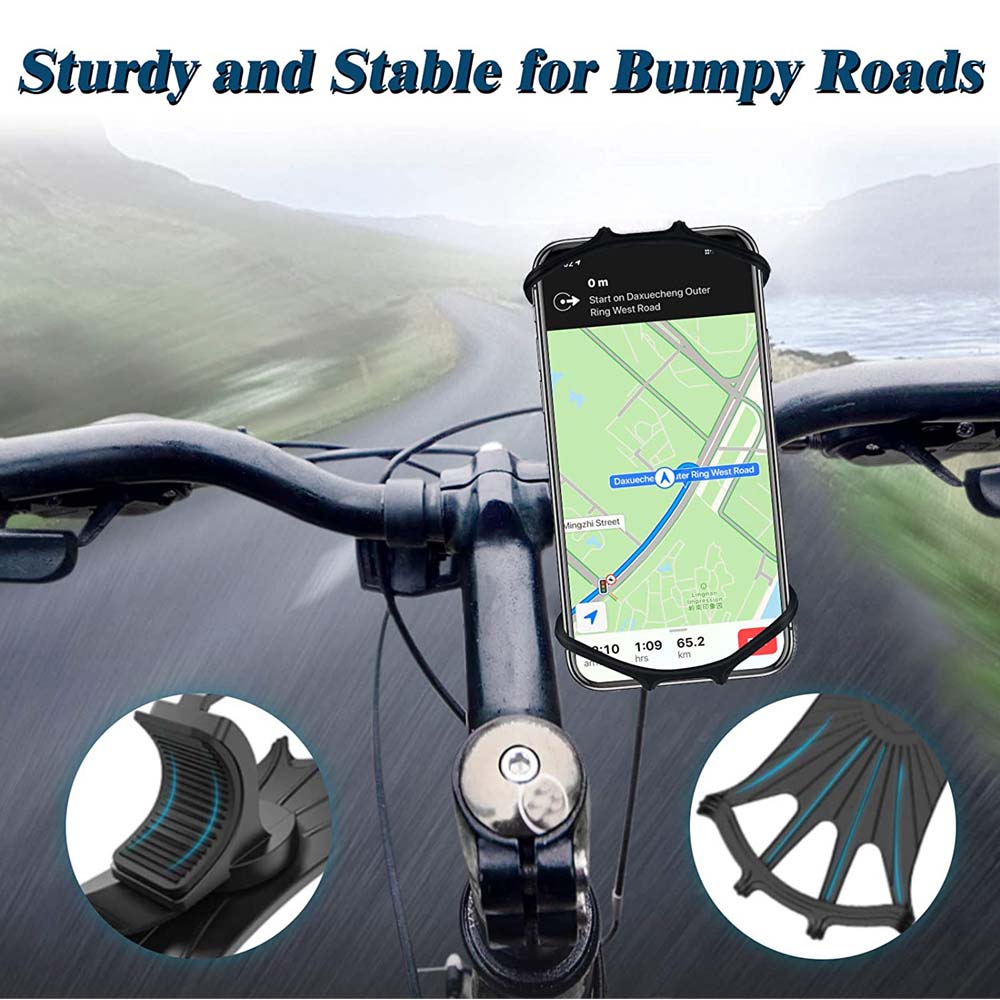 Phone showing a map in the mount on a bike's handlebars on a country road