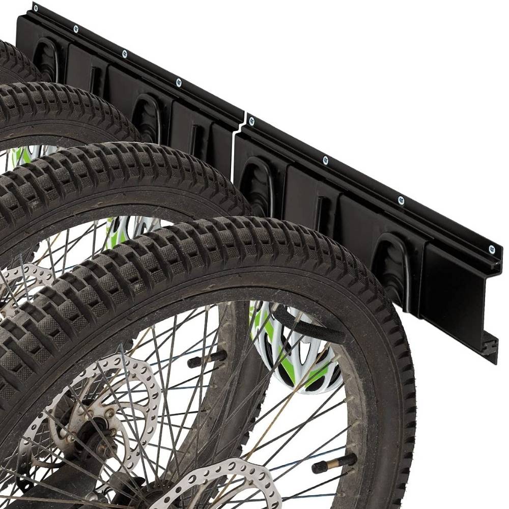 Fat tyre wheels resting on hooks along the wall rail