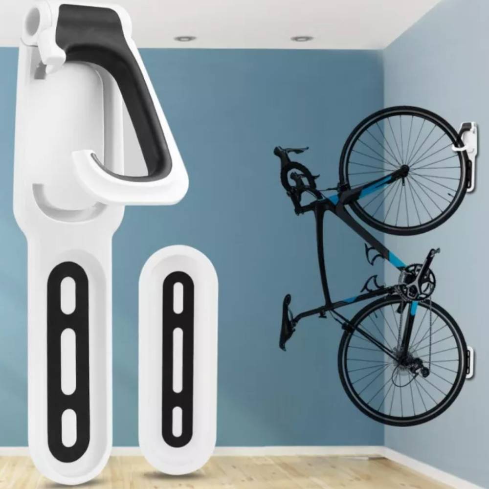 White wall hanger with a bike hanging upright on a blue wall